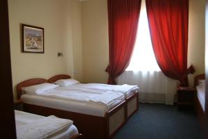 Łóżko lub łóżka w pokoju w obiekcie Motel Kilometrul Zero
