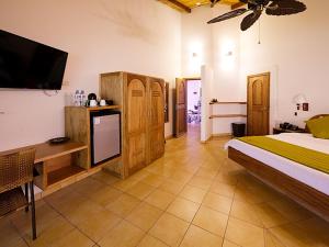 Postel nebo postele na pokoji v ubytování Arahuana Jungle Resort & Spa