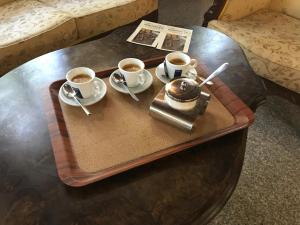a tray with two cups of coffee on a table at Къща Стария град in Plovdiv