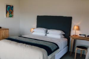 Ένα ή περισσότερα κρεβάτια σε δωμάτιο στο Black Estate B & B