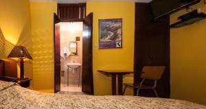 Cama ou camas em um quarto em Hostal Iquique