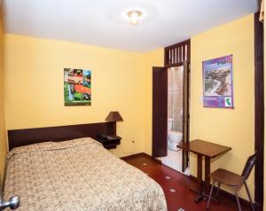 Cama ou camas em um quarto em Hostal Iquique