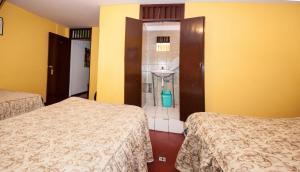 Cama ou camas em um quarto em Hostal Iquique