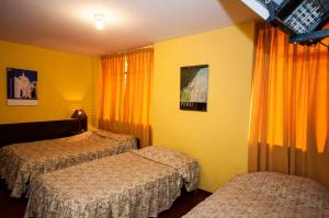 Cama ou camas em um quarto em Hostal Iquique