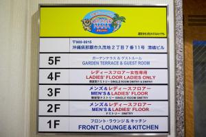 a sign for a grand marina restaurant at Guest House Grand Naha in Naha