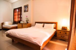 Llit o llits en una habitació de Flower Memory Homestay