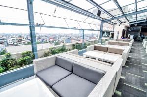 a view from the top of a building with chairs at El Cavana Bandung in Bandung