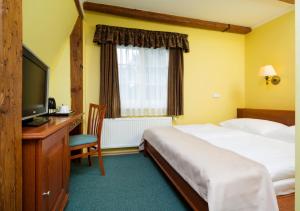 Postel nebo postele na pokoji v ubytování Spa Resort Libverda - Hotel Lesní Zátiší