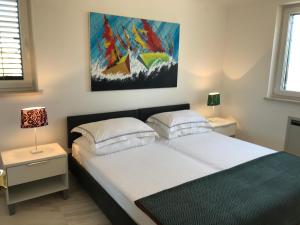 Postel nebo postele na pokoji v ubytování Apartments Victoria Privlaka