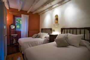 Llit o llits en una habitació de Casa Rural Mendiburu