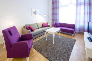 a living room filled with furniture and a couch at Holiday Club Tampere Spa Apartments in Tampere