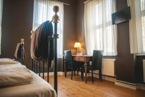 TV a/nebo společenská místnost v ubytování Hotel Alexander