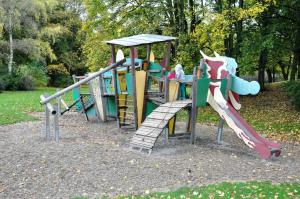 a playground with a slide in a park at Apartments am Freizeitpark in Kriftel