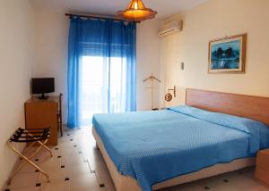 Cama ou camas em um quarto em Hotel Solemar
