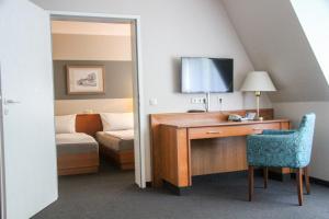 Postel nebo postele na pokoji v ubytování Schlossberghotel Greiz