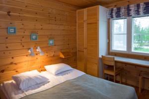 Кровать или кровати в номере Holiday Club Salla Apartments +37 фотографий