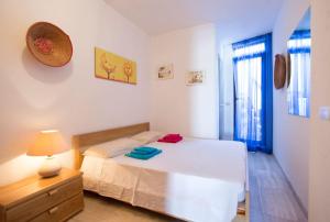 Tempat tidur dalam kamar di Casa i Cormorani- Fantastica vista sul golfo dell'Asinara