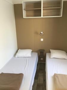A bed or beds in a room at Camping Milella