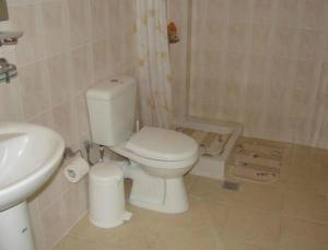 a bathroom with a toilet and a sink at Anett Studios in Elafonisos