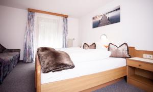 A bed or beds in a room at Apart Peter
