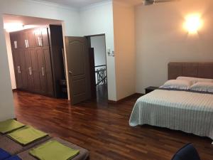Postel nebo postele na pokoji v ubytování Putrajaya 1808 Homestay
