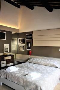Appartamento Via Mazzini tesisinde bir odada yatak veya yataklar