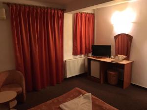 TV a/nebo společenská místnost v ubytování Hotel Corsa