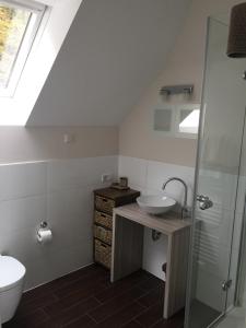 a bathroom with a sink and a toilet at Schwedenfrieden in Bielefeld