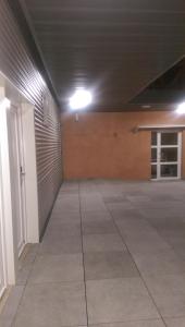 an empty garage with a garage door and a ceiling at El Raco De Navarrete in Cabanes
