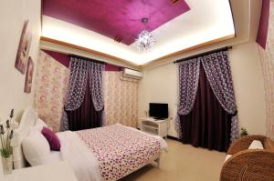 TV/trung tâm giải trí tại 愛樂耕民宿 Elegant Homestay +25 ảnh