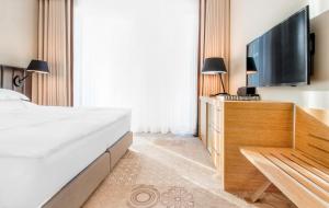 Łóżko lub łóżka w pokoju w obiekcie Tiffi Boutique Hotel