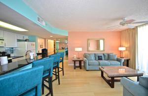 a living room with a couch and a table at Sunrise Suites Cayo Coco Suite #208 in Key West