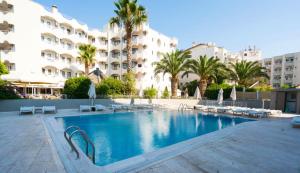 a large swimming pool in front of a building at Yunus Beach Hotel in Marmaris