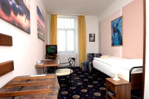 מיטה או מיטות בחדר ב-Brioni Boutique Hotel 4*