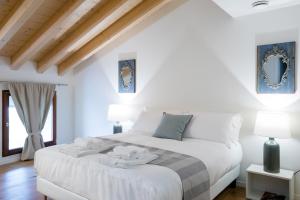 Postel nebo postele na pokoji v ubytování La Ripa Boutique Hotel