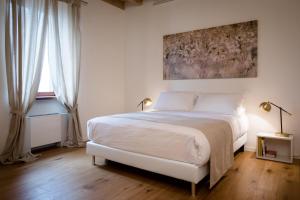 Postel nebo postele na pokoji v ubytování La Ripa Boutique Hotel