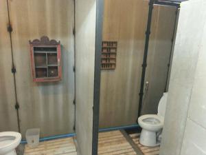 a bathroom with two toilets and a window at The Roo Classic Hometel in Songkhla