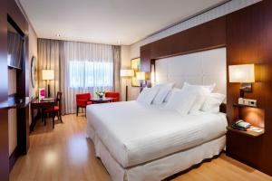 A bed or beds in a room at Barceló Granada Congress