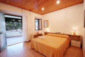 מיטה או מיטות בחדר ב-Hotel La Stella