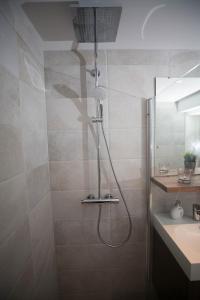 a bathroom with a shower and a sink at Apartment at Ranheim in Trondheim