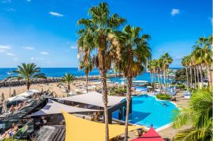 a view of a resort with a pool and a beach at Calheta Beach - All-inclusive - Savoy Signature in Calheta