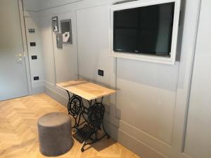TV a/nebo společenská místnost v ubytování Hotel 5 Colonne
