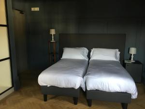 Postel nebo postele na pokoji v ubytování Hotel 5 Colonne