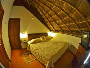 Giường trong phòng chung tại La Aldea Hotel & Spa