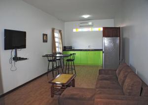 a living room with a couch and a table at Joah Inn Appartementen in Paramaribo