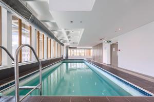 a swimming pool in a building at #1101 Cartwright - Chic Downtown Apartment in Cape Town