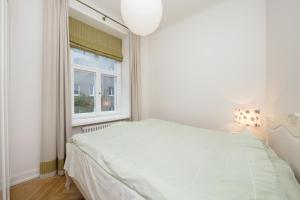 Postel nebo postele na pokoji v ubytování Harju Old Town Apartment