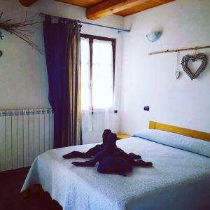 Postel nebo postele na pokoji v ubytování Bricco Del Gallo