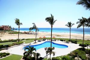 a view of the beach from the balcony of a resort at Condominios Brisa - Ocean Front in Cabo San Lucas