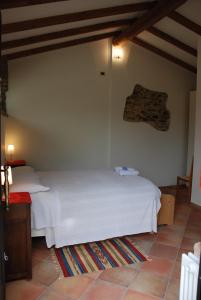 מיטה או מיטות בחדר ב-R&B Albero Cavo Parma